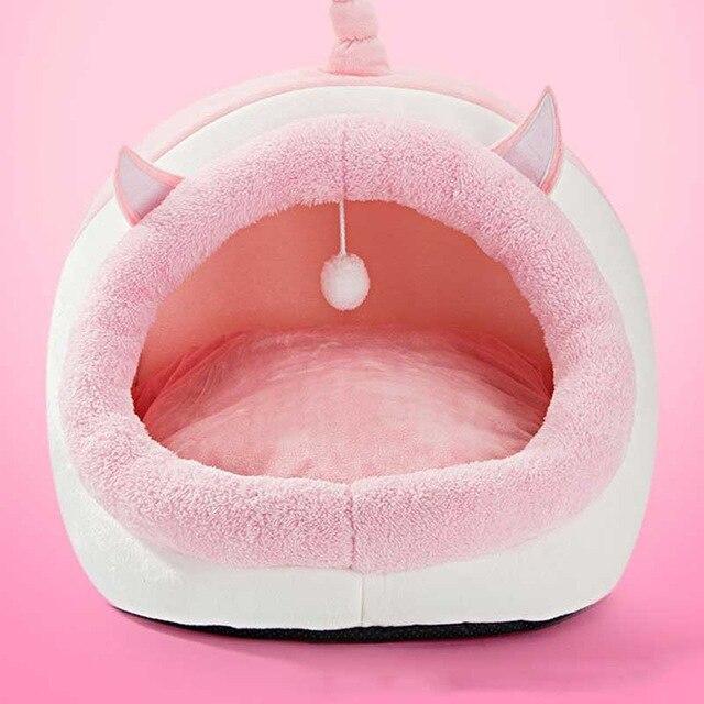 Cute unicorn-shaped pet bed for dogs and cats, featuring a soft cotton exterior and a cozy interior, perfect for winter warmth.