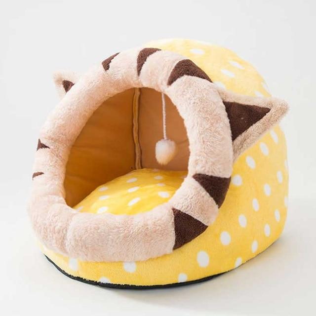 Cute unicorn-shaped pet bed for dogs and cats, featuring a soft cotton exterior and a cozy interior, perfect for winter warmth.
