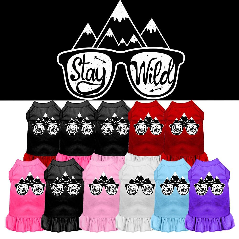 A cute dog wearing a 'Stay Wild' dress, showcasing a vibrant screen print design, perfect for pets of all sizes.