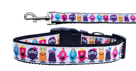 A colorful nylon collar and leash set for pets featuring a fun 'Monsters' design, showcasing durability and style.