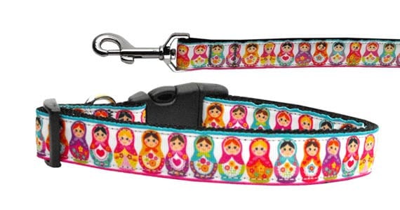 A stylish nylon collar and leash set for dogs and cats featuring a colorful 'Pretty Nesting Dolls' design, showcasing durability and safety features.