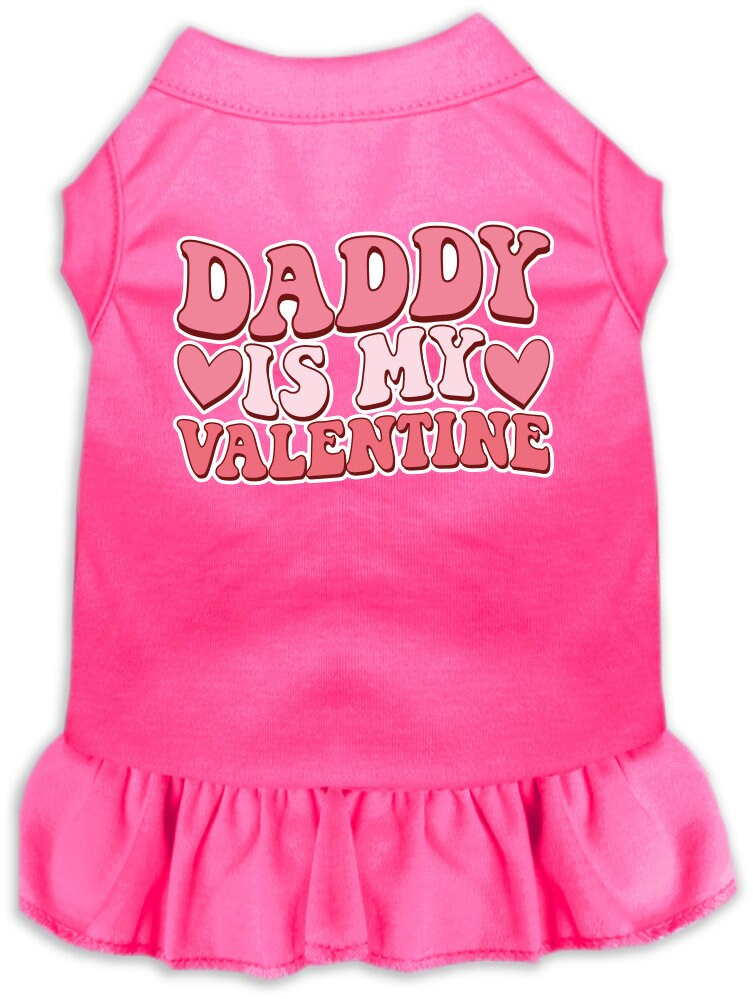 A cute pet dress for dogs and cats, featuring a ruffled bottom and the text 'Daddy Is My Valentine' in a playful font.