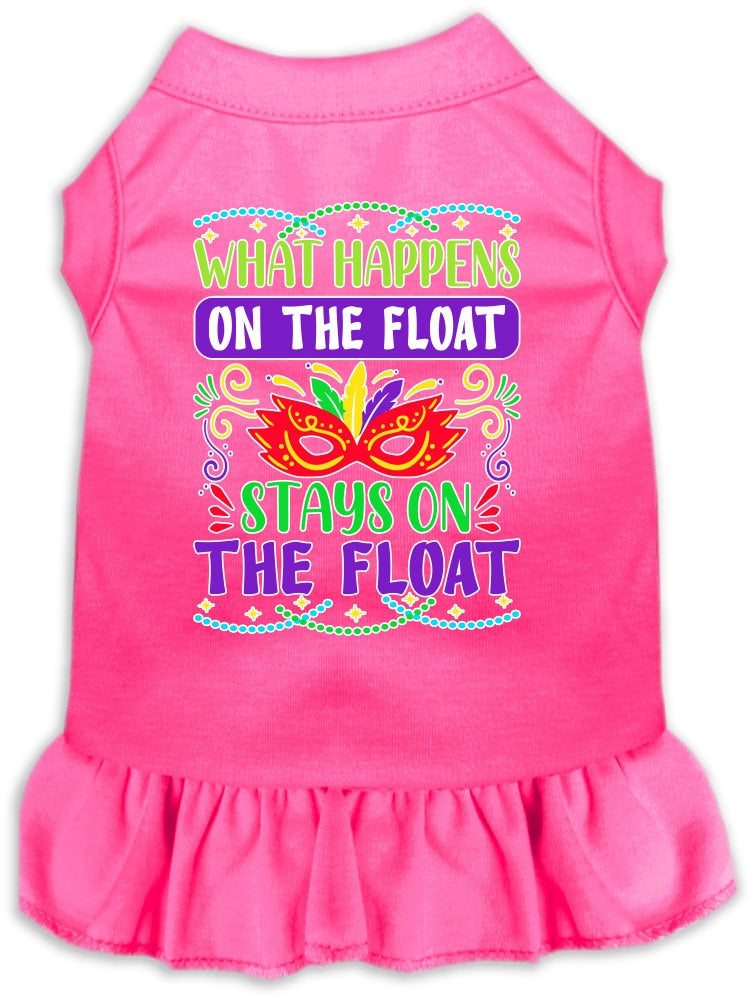 A medium to large pet wearing a cute screen printed dress with ruffles, featuring the phrase 'What Happens On The Float, Stays On The Float'.