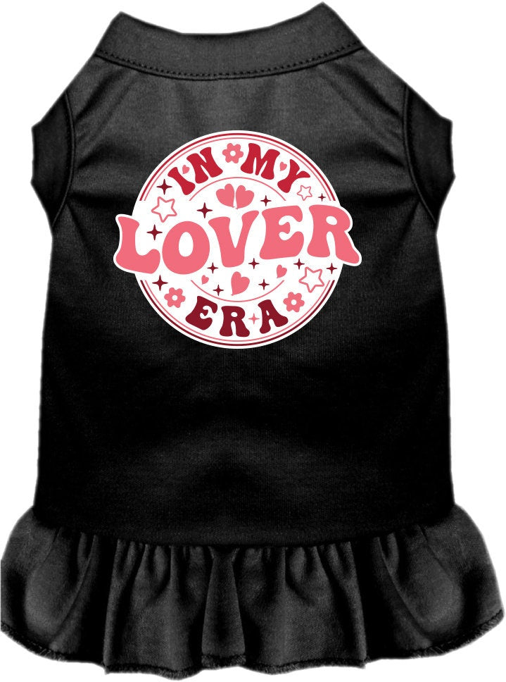 A small to medium pet wearing a stylish screen printed dress with ruffles, labeled 'In My Lover Era', showcasing comfort and cuteness.