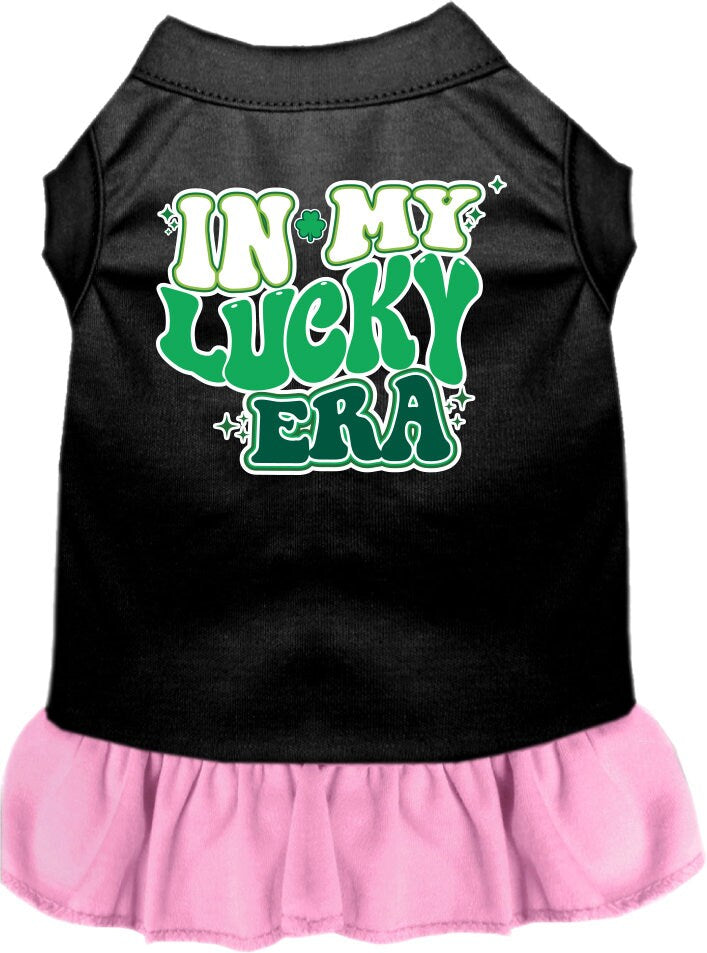 A small to medium pet wearing a stylish screen printed dress with ruffles, featuring the text 'In My Lucky Era'.