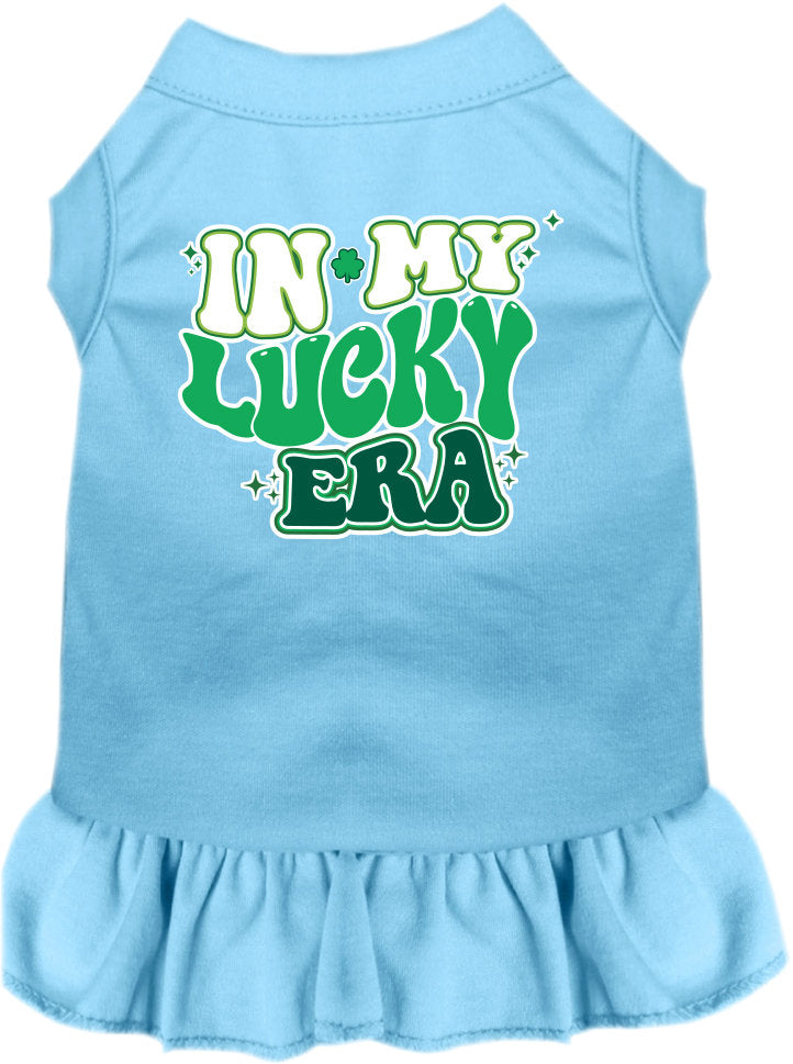 A small to medium pet wearing a stylish screen printed dress with ruffles, featuring the text 'In My Lucky Era'.