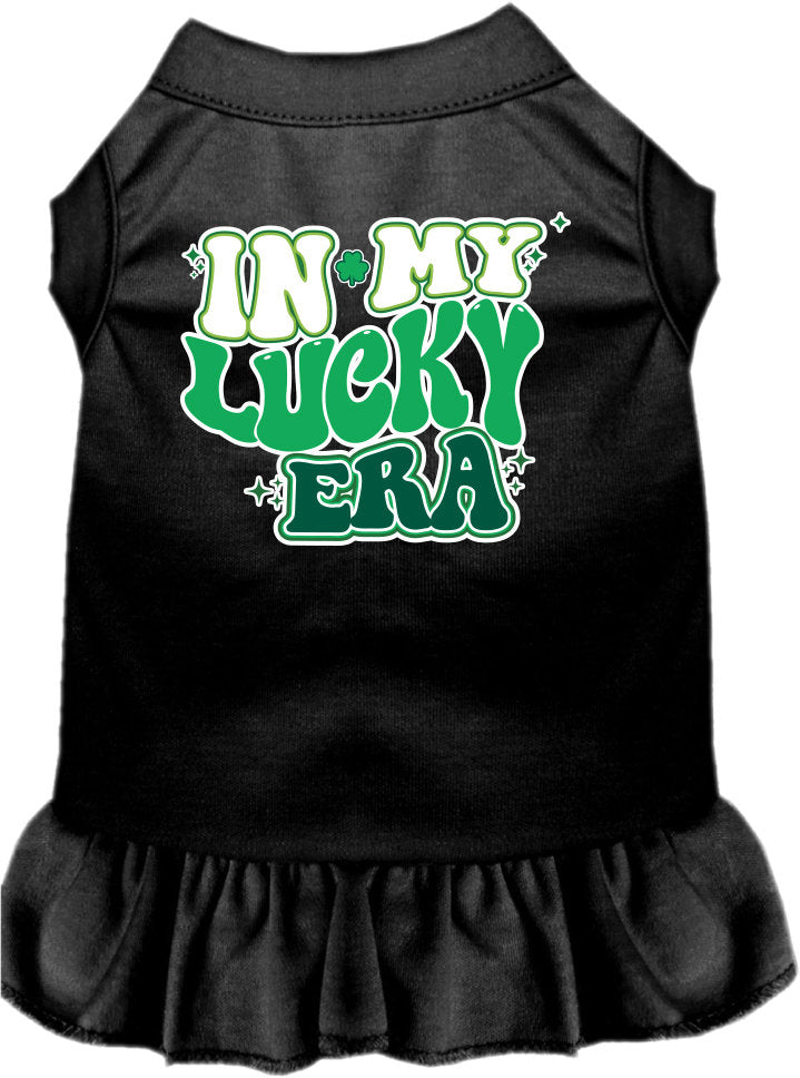 A small to medium pet wearing a stylish screen printed dress with ruffles, featuring the text 'In My Lucky Era'.
