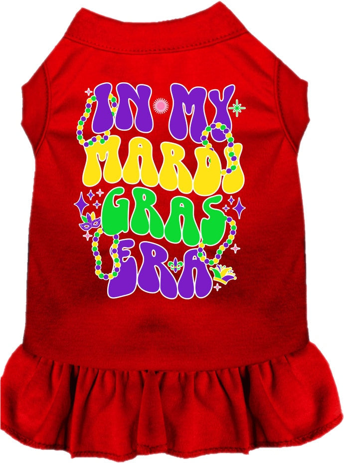 A small to medium pet wearing a colorful screen printed dress with ruffles, titled 'In My Mardi Gras Era', showcasing vibrant Mardi Gras colors.