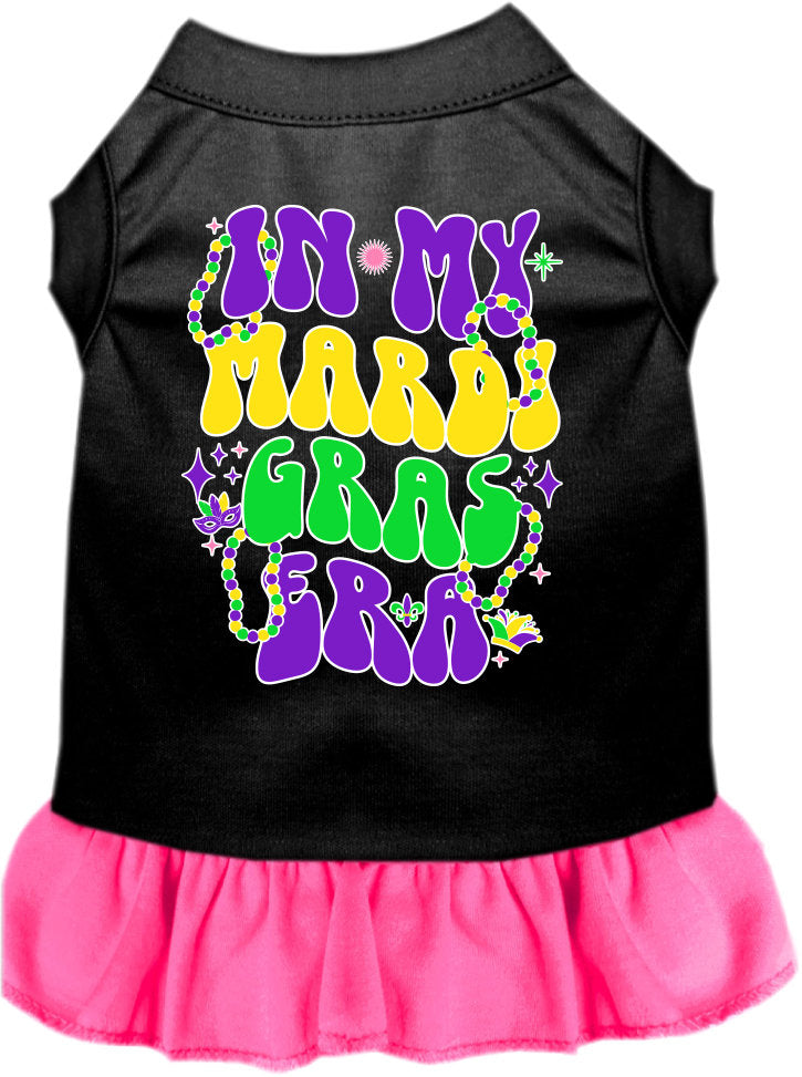 A small to medium pet wearing a colorful screen printed dress with ruffles, titled 'In My Mardi Gras Era', showcasing vibrant Mardi Gras colors.