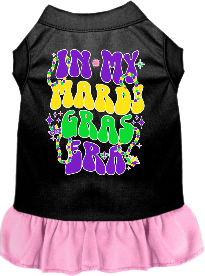 A small to medium pet wearing a colorful screen printed dress with ruffles, titled 'In My Mardi Gras Era', showcasing vibrant Mardi Gras colors.