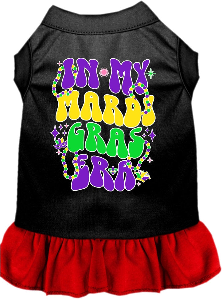A small to medium pet wearing a colorful screen printed dress with ruffles, titled 'In My Mardi Gras Era', showcasing vibrant Mardi Gras colors.