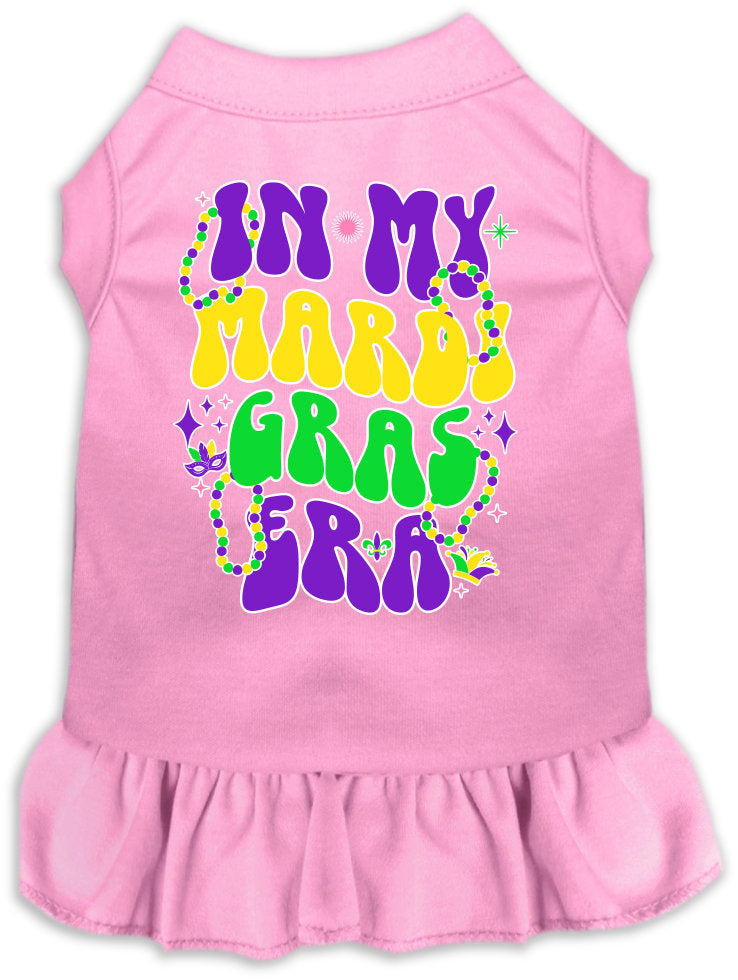 A small to medium pet wearing a colorful screen printed dress with ruffles, titled 'In My Mardi Gras Era', showcasing vibrant Mardi Gras colors.