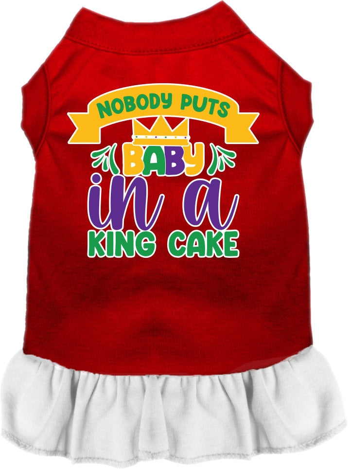 A cute screen printed dress for small to medium pets, featuring ruffles and the phrase 'Nobody Puts Baby In A King Cake'.