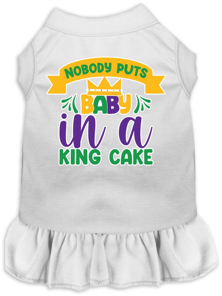 A cute screen printed dress for small to medium pets, featuring ruffles and the phrase 'Nobody Puts Baby In A King Cake'.