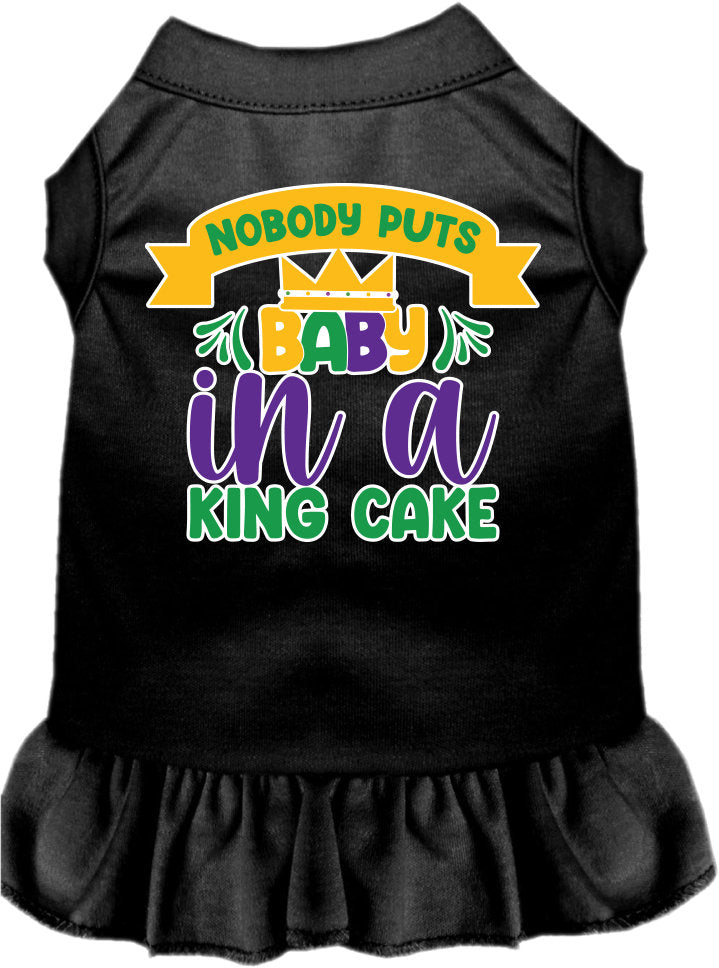 A cute screen printed dress for small to medium pets, featuring ruffles and the phrase 'Nobody Puts Baby In A King Cake'.