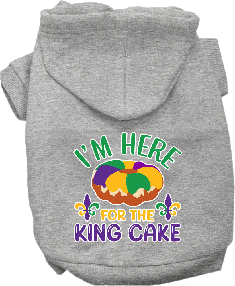 A cozy screen printed hoodie for medium to large pets featuring the phrase 'I'm Here For The King Cake', designed for comfort and durability.