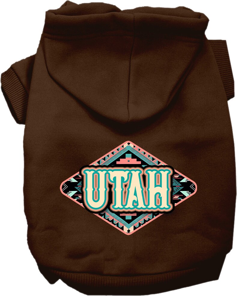 A medium to large pet wearing a soft, warm hoodie with a Utah Peach Aztec print, showcasing its stylish design and convenient leash access.