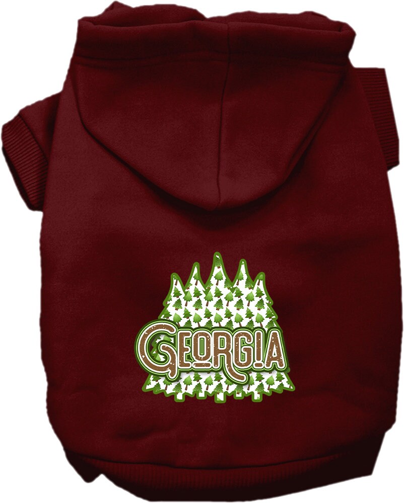 A medium to large pet wearing a soft and warm screen printed hoodie featuring 'Georgia Woodland Trees', showcasing its stylish design and convenient leash access.