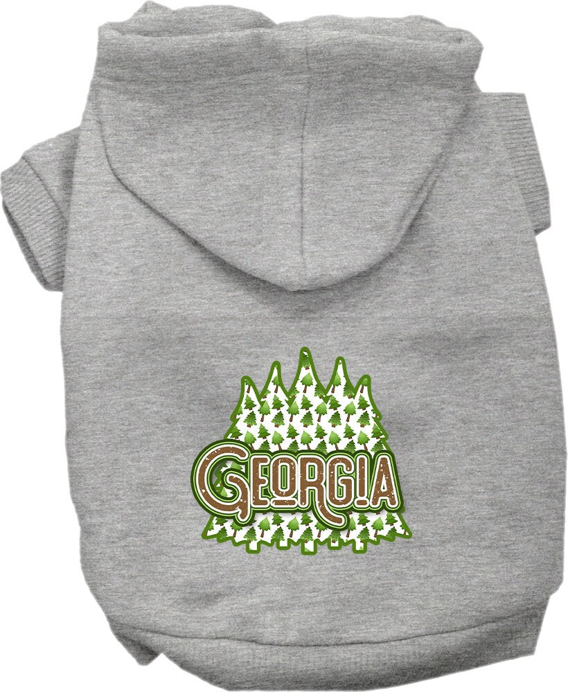 A medium to large pet wearing a soft and warm screen printed hoodie featuring 'Georgia Woodland Trees', showcasing its stylish design and convenient leash access.