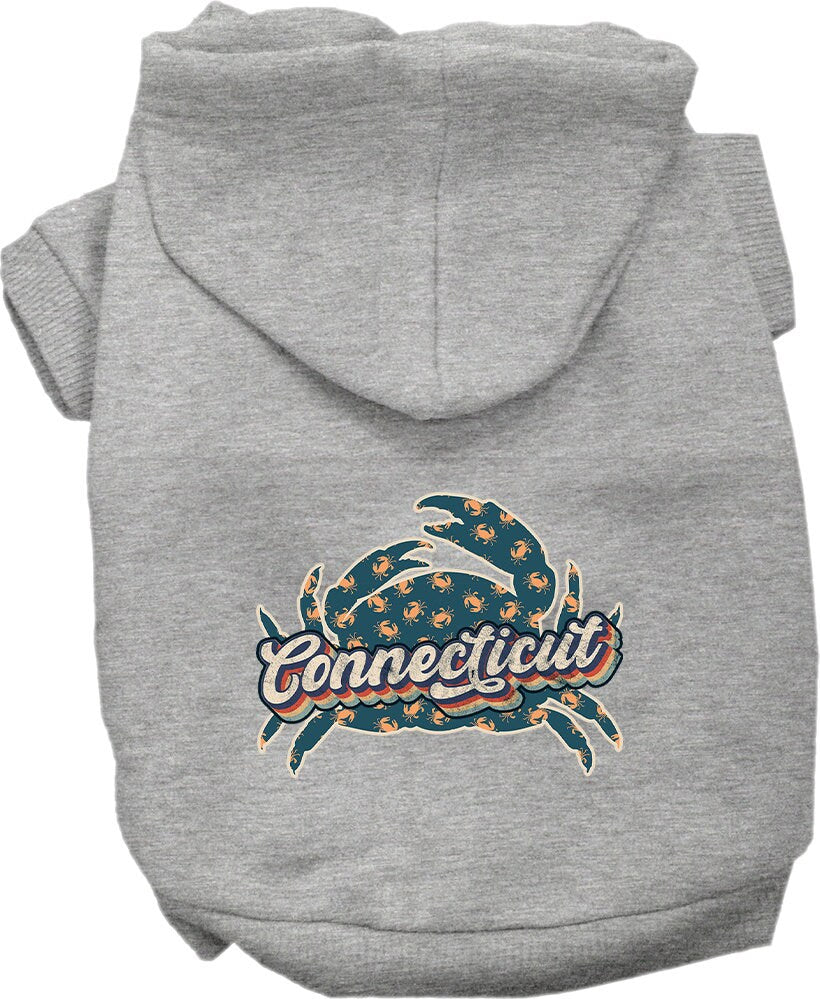 A medium to large pet wearing a stylish screen printed hoodie featuring a Connecticut Retro Crabs design, showcasing comfort and durability.