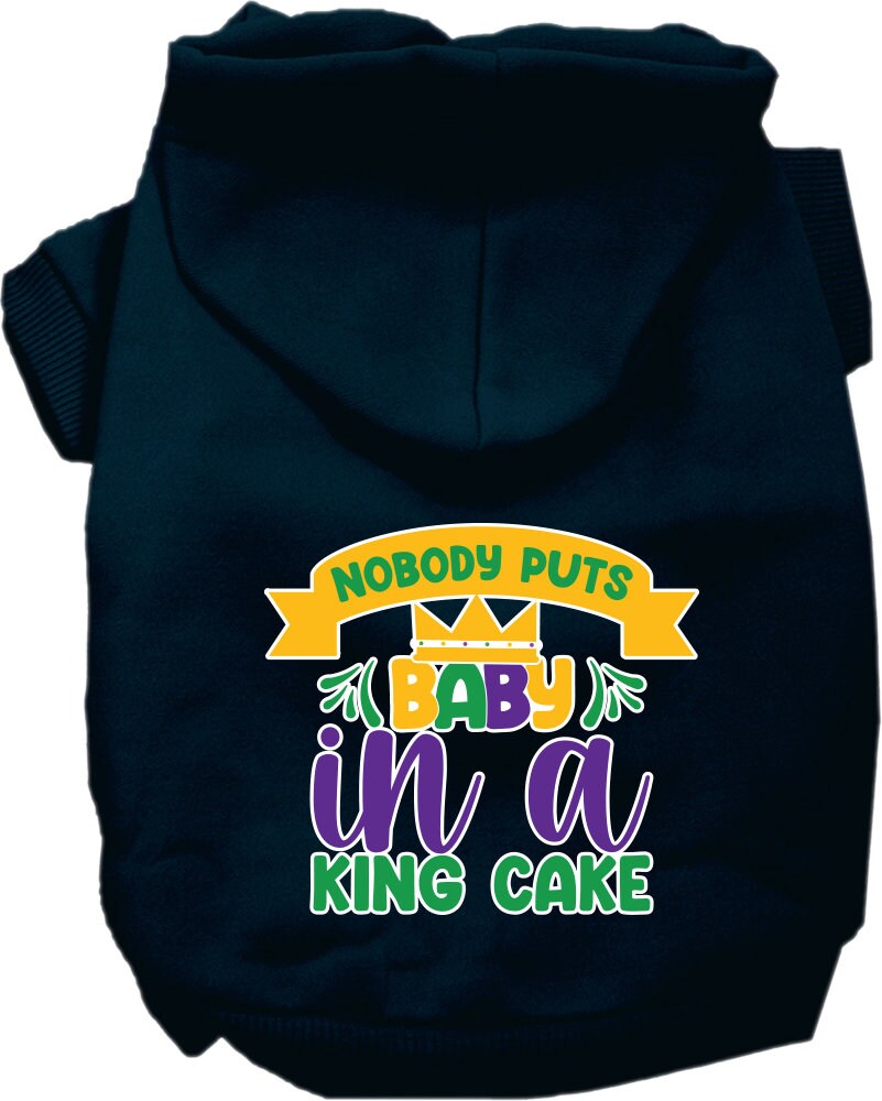A medium to large pet wearing a soft, warm hoodie with the phrase 'Nobody Puts Baby In A King Cake' printed on it, showcasing its stylish design.