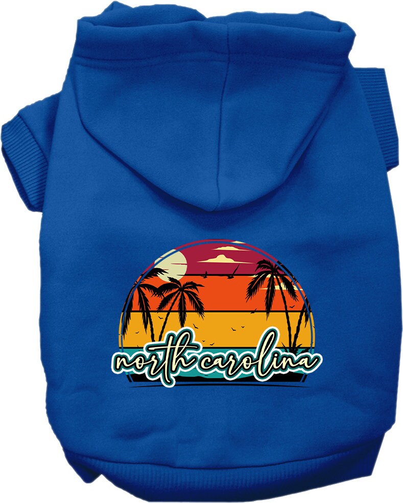 A medium to large pet wearing a soft and stylish screen printed hoodie featuring a North Carolina retro beach sunset design.