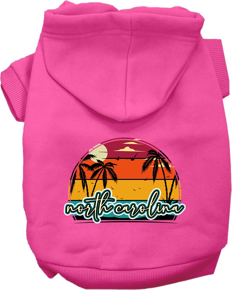 A medium to large pet wearing a soft and stylish screen printed hoodie featuring a North Carolina retro beach sunset design.