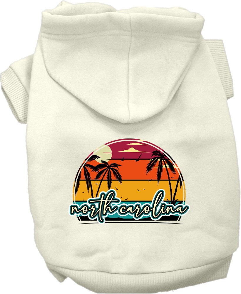 A medium to large pet wearing a soft and stylish screen printed hoodie featuring a North Carolina retro beach sunset design.