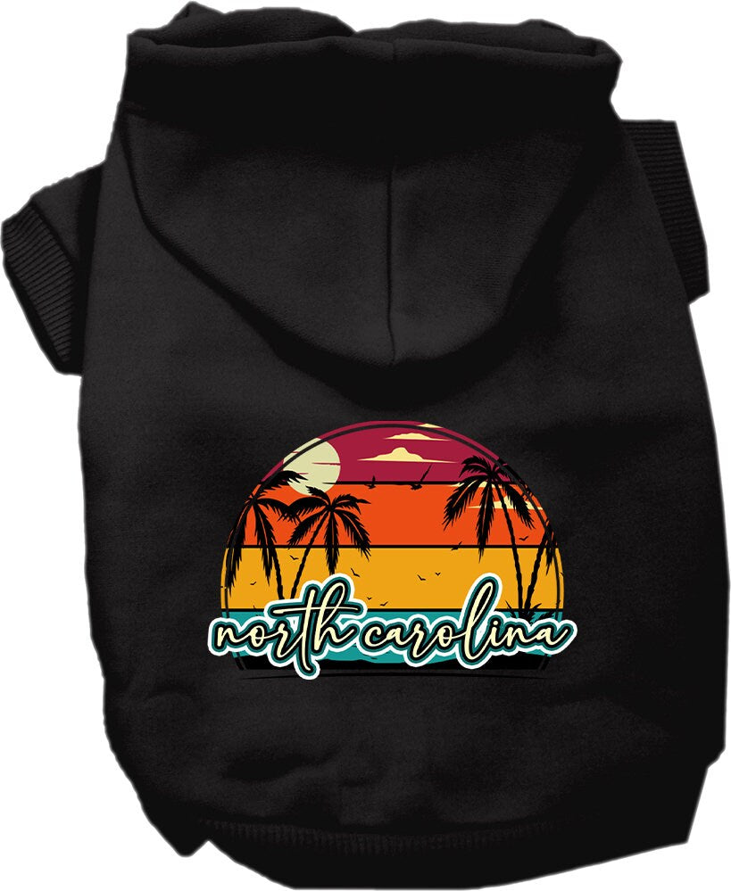 A medium to large pet wearing a soft and stylish screen printed hoodie featuring a North Carolina retro beach sunset design.