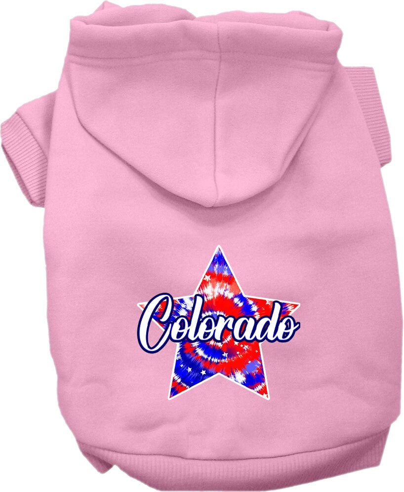 A medium to large pet wearing a Colorado Patriotic Tie Dye hoodie, showcasing its vibrant colors and comfortable fit.