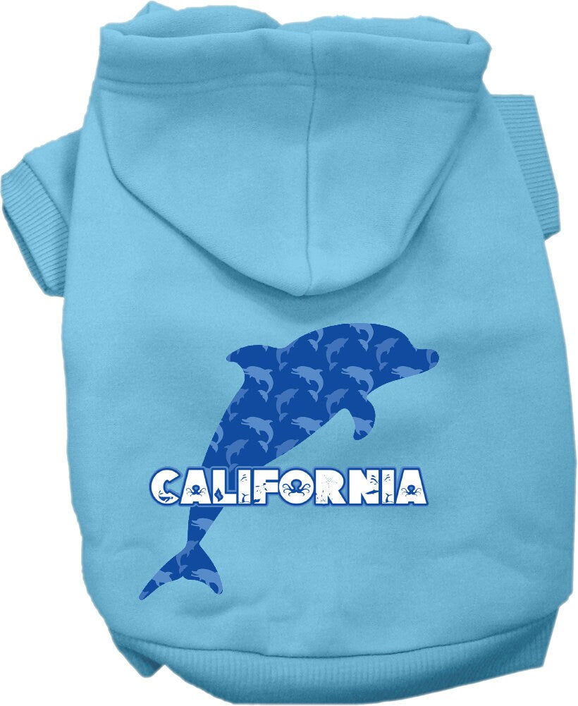 A medium to large pet wearing a California Blue Dolphins screen printed hoodie, showcasing its vibrant design and comfortable fit.