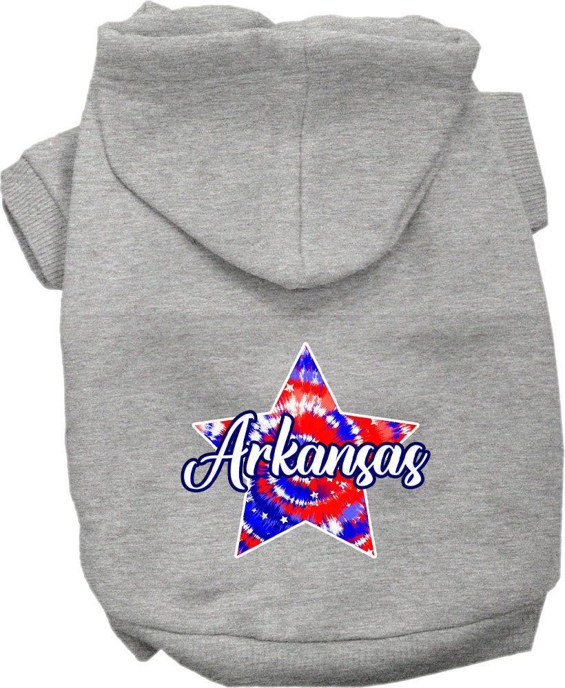 A medium to large pet wearing a soft, stylish Arkansas Patriotic Tie Dye hoodie, showcasing its vibrant colors and convenient leash access hole.