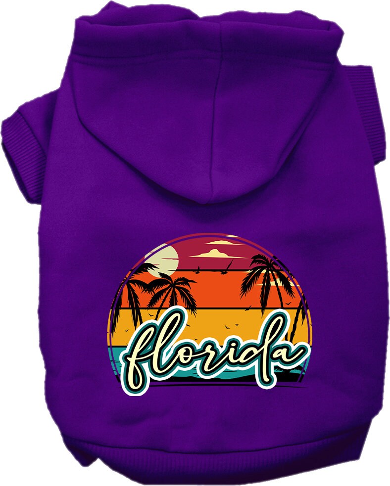 A medium to large pet wearing a soft, stylish hoodie featuring a Florida Retro Beach Sunset design, perfect for walks and lounging.
