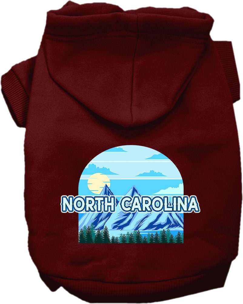 A cozy screen printed hoodie for small to medium pets, featuring the 'North Carolina Trailblazer' design, showcasing its soft fabric and leash access hole.