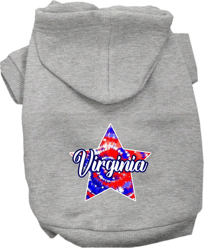 A small to medium pet wearing a Virginia Patriotic Tie Dye hoodie, showcasing its vibrant colors and comfortable fit.