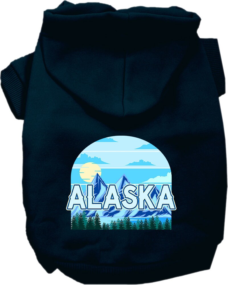 A small to medium pet wearing a cozy Alaska Trailblazer hoodie, showcasing its stylish design and convenient leash access hole.