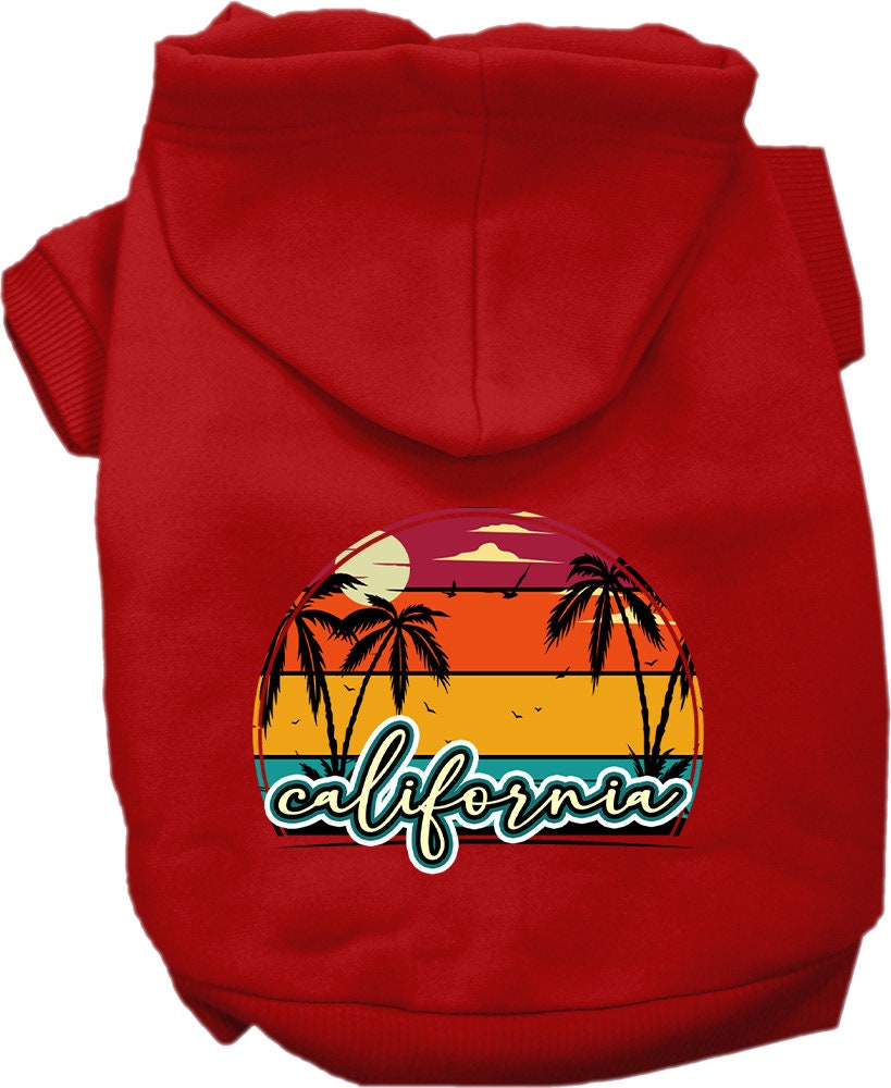 A small to medium pet wearing a California Retro Beach Sunset hoodie, showcasing vibrant colors and a stylish design.