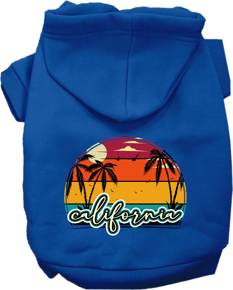 A small to medium pet wearing a California Retro Beach Sunset hoodie, showcasing vibrant colors and a stylish design.