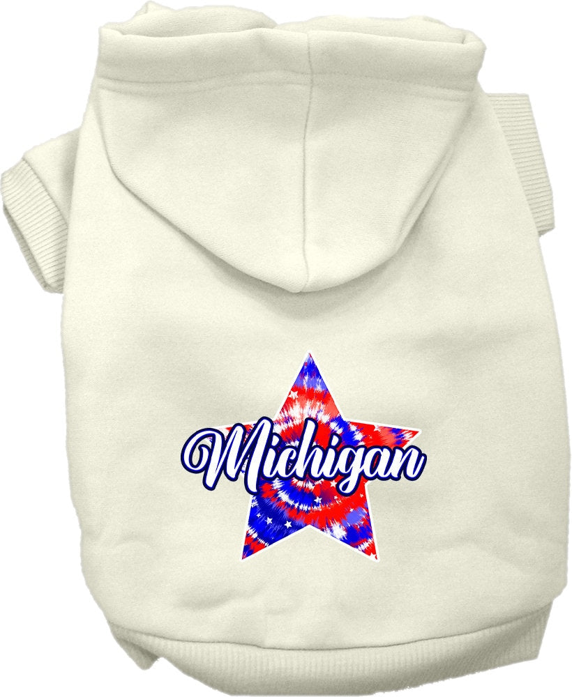 A small to medium pet wearing a Michigan Patriotic Tie Dye hoodie, showcasing its vibrant colors and comfortable fit.