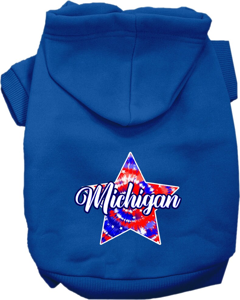 A small to medium pet wearing a Michigan Patriotic Tie Dye hoodie, showcasing its vibrant colors and comfortable fit.