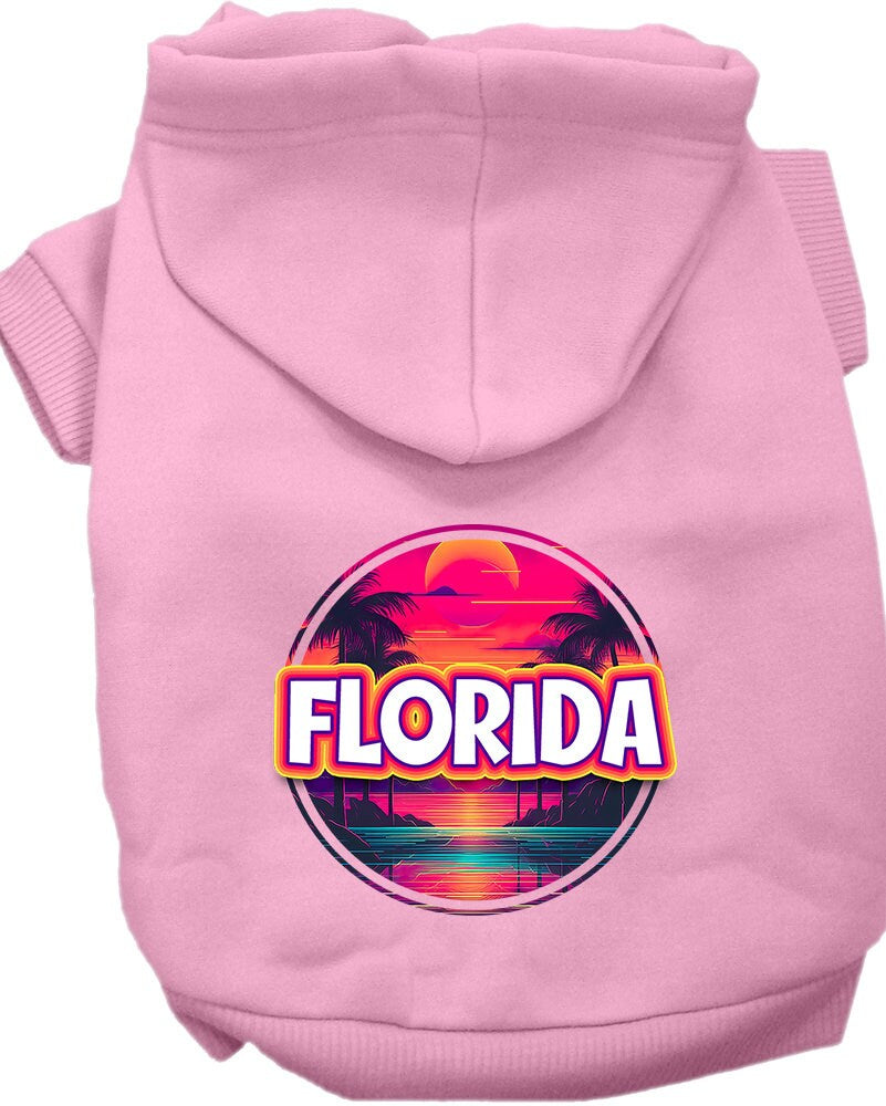 A small to medium pet wearing a vibrant Florida Neon Beach Sunset hoodie, showcasing its soft fabric and stylish design.