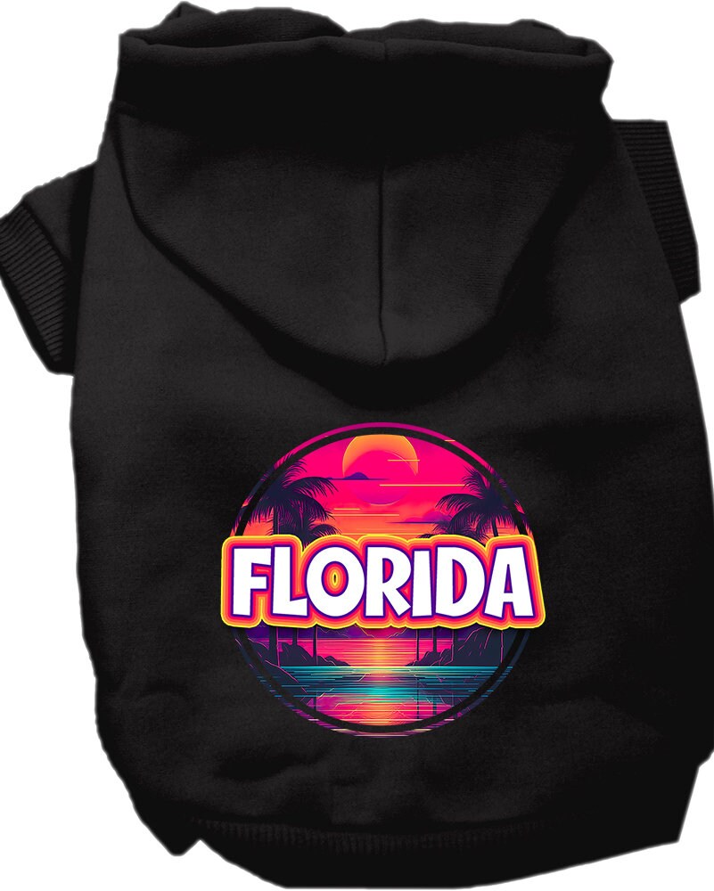 A small to medium pet wearing a vibrant Florida Neon Beach Sunset hoodie, showcasing its soft fabric and stylish design.