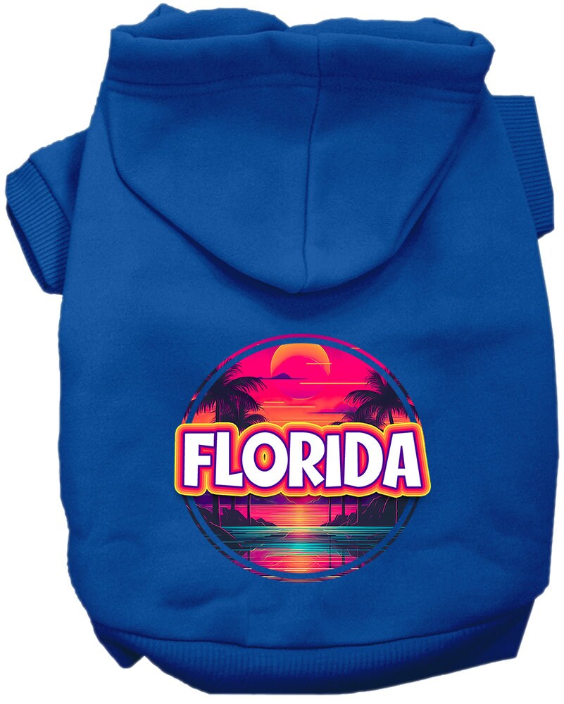 A small to medium pet wearing a vibrant Florida Neon Beach Sunset hoodie, showcasing its soft fabric and stylish design.