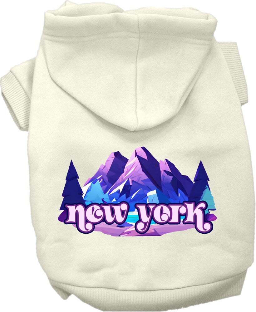 A small to medium pet wearing a stylish screen printed hoodie with a 'New York Alpine Pawscape' design, showcasing comfort and durability.