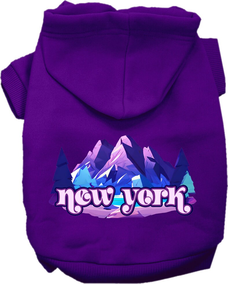 A small to medium pet wearing a stylish screen printed hoodie with a 'New York Alpine Pawscape' design, showcasing comfort and durability.