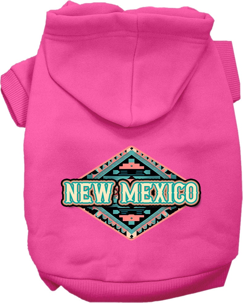 A small to medium pet wearing a soft, warm hoodie with a New Mexico Peach Aztec design, showcasing its stylish and durable features.
