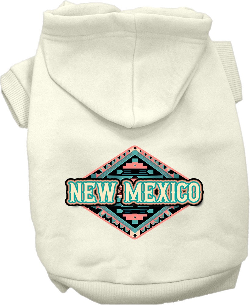 A small to medium pet wearing a soft, warm hoodie with a New Mexico Peach Aztec design, showcasing its stylish and durable features.
