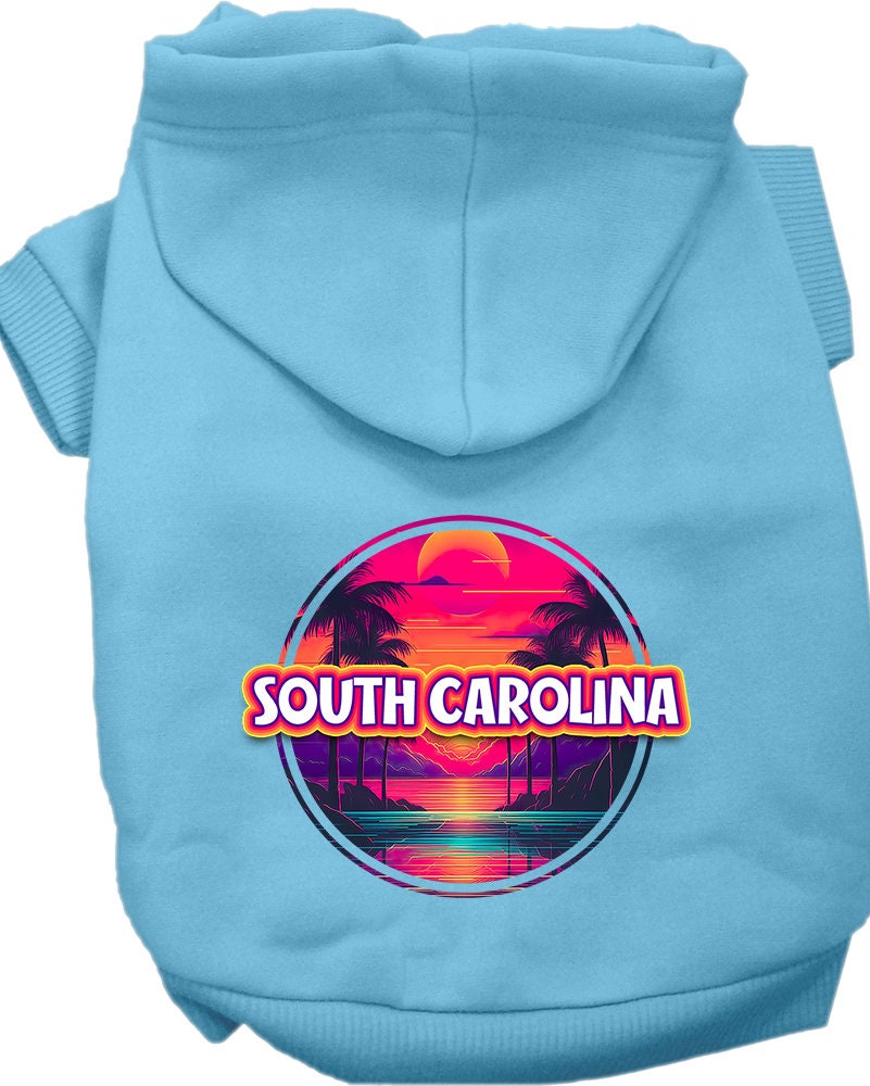 A small to medium pet wearing a vibrant South Carolina Neon Beach Sunset hoodie, showcasing its soft fabric and convenient leash access hole.