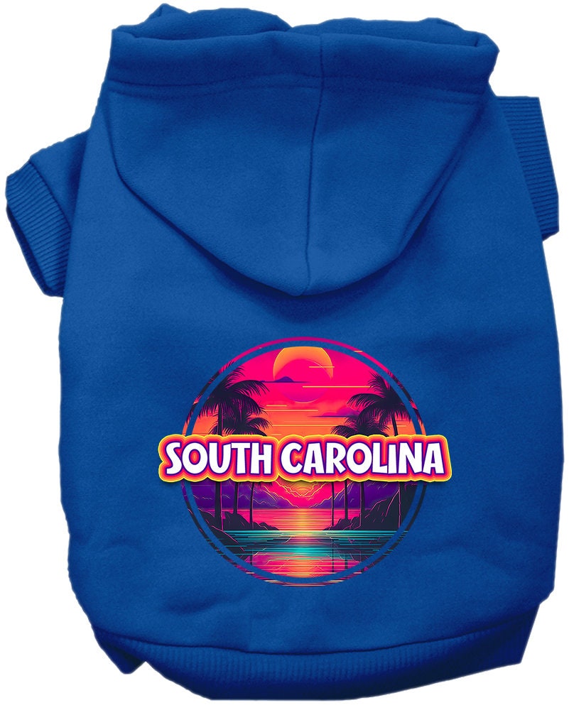A small to medium pet wearing a vibrant South Carolina Neon Beach Sunset hoodie, showcasing its soft fabric and convenient leash access hole.