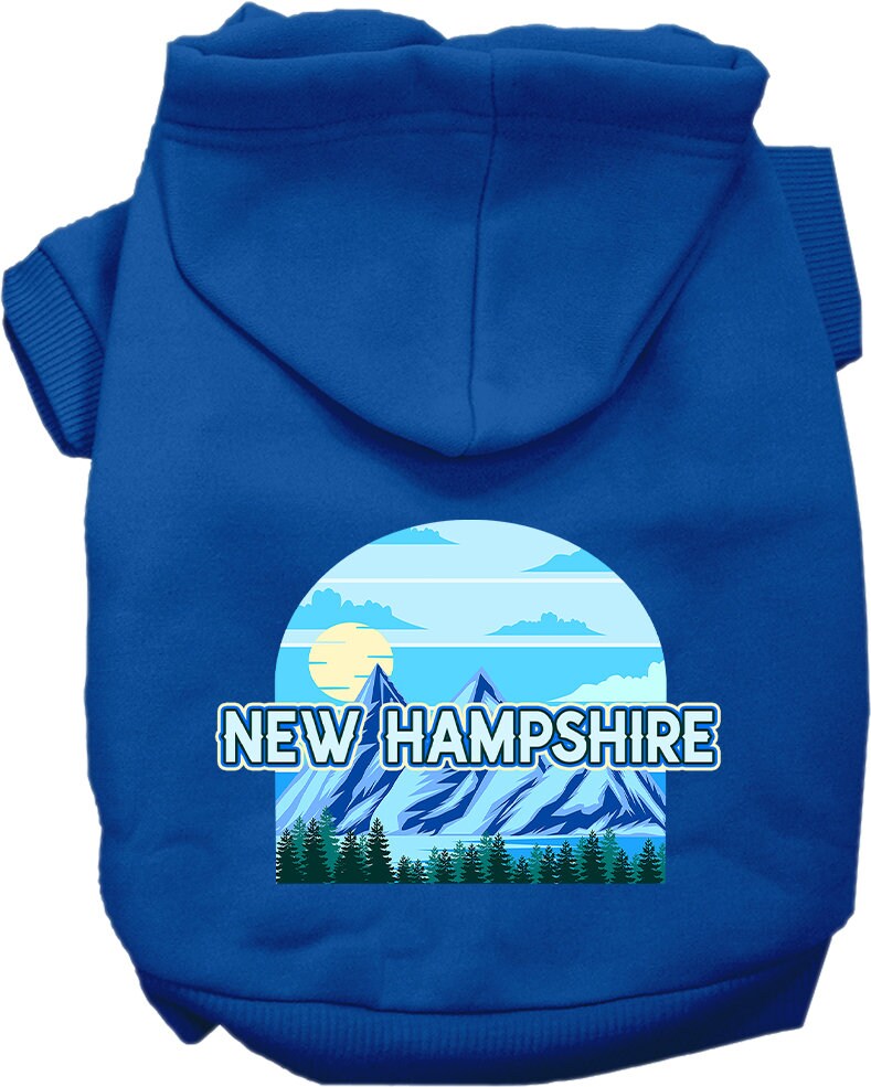 A small to medium pet wearing a stylish screen printed hoodie with a New Hampshire Trailblazer design, showcasing its soft fabric and convenient leash access.